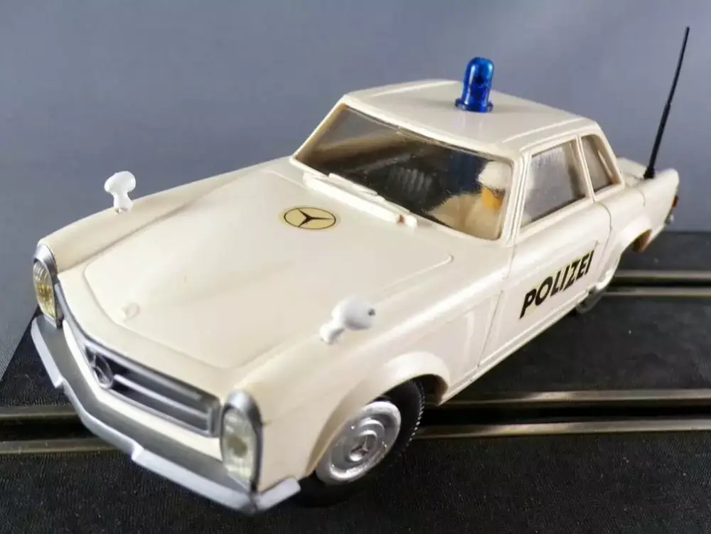 Stabo 40016 - Mercedes 230SL Police Blanche Vitrage Transparent Parechocs Gris Rétroviseurs sans Boite 1/32 Authentique
